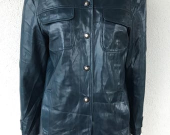May include: A teal blue leather jacket with a button-up front and two flap pockets.