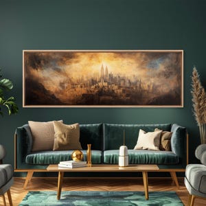 May include: A framed cityscape painting with a warm, golden-hued sky and a detailed depiction of buildings. The artwork is displayed above a teal sofa with decorative pillows, a wooden coffee table, and a green rug, creating a cozy living room setting.