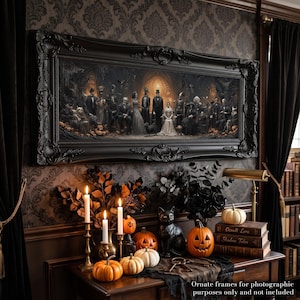 May include: A panoramic wall art print in a wide, ornate black frame featuring a dark, gothic-style group portrait of figures in formal attire. The scene includes a central seated figure in a white gown, surrounded by individuals in suits and dresses.