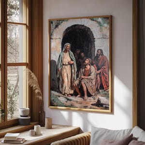 May include: A framed religious painting depicts a scene with several figures in draped robes. The central figure, in a light-colored robe and blue cloak, stands before a group of men. The artwork is set against a backdrop of an arched doorway.