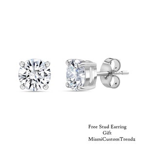 May include: A pair of silver stud earrings with clear round cubic zirconia stones. Free Stud Earring Gift MiamiCustomTrendz.