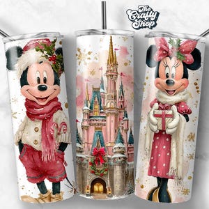 May include: Three white insulated tumblers with stainless steel straws. The tumblers feature festive watercolour designs of Mickey Mouse, Minnie Mouse, and a castle. Mickey Mouse is wearing a red scarf and shorts. Minnie Mouse is holding a gift.