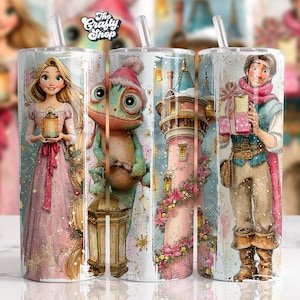 May include: Set of three stainless steel tumblers featuring fairytale characters. Each tumbler has a different design: a princess holding a lantern, a chameleon in a Santa hat, and a prince with gifts. The tumblers have a clear straw.