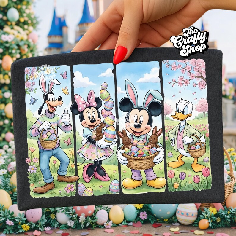 May include: Black graphic tee featuring Disney characters Goofy, Minnie Mouse, Mickey Mouse, and Donald Duck, all dressed for Easter. Each character holds Easter eggs and baskets. The tee has the text "The Crafty Shop".