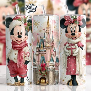 May include: Three stainless steel tumblers with festive designs. One features Mickey Mouse in winter attire, another shows Cinderella's castle, and the third depicts Minnie Mouse with a gift. Each tumbler has a straw and a seasonal design.