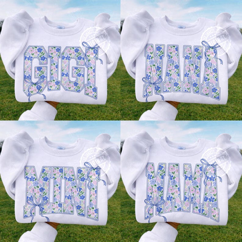 May include: White sweatshirts with the words "GIGI", "MAMA", "MINI", and "MAMA" in a floral design. The floral design includes blue and pink flowers. Each word has a blue bow. The sweatshirts have puffy sleeves.