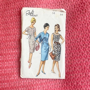 May include: Vintage sewing pattern for three dresses, featuring a geometric print, a blue dress with a matching jacket, and a leopard print dress. The pattern is labelled "Style's Print" and includes instructions for size 34.