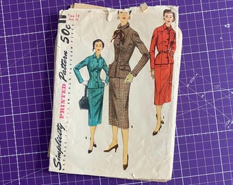 May include: Vintage Simplicity printed sewing pattern featuring illustrations of women's suits. The pattern includes a size 14, bust 32. The cover shows three different suit designs in teal, brown, and red. The pattern is printed on paper.