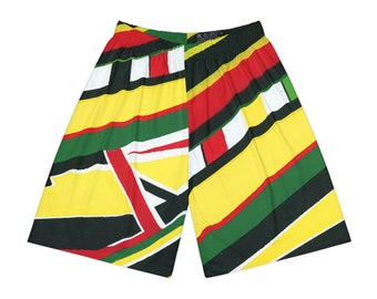 May include: Yellow, red, green, and black patterned shorts with a geometric design.