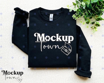 May include: Black sweatshirt with white text that says "Mockup Town" and a camera graphic.