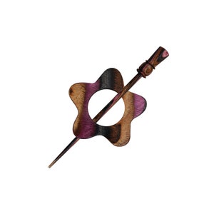 May include: A wooden hair stick with a star-shaped head. The stick is brown and pink with a wood grain pattern. The star has a hole in the center.