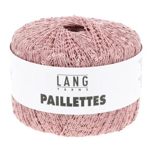 May include: A ball of dusty pink yarn featuring a delicate, open-knit texture embedded with small, reflective sequins. A white paper label wraps around the center, printed with the black text LANG YARNS and the word PAILLETTES in bold letters.