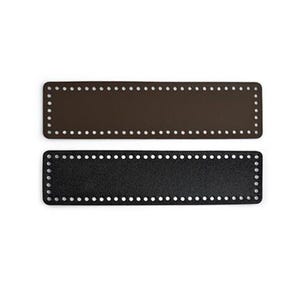 May include: Two leather straps with holes for weaving. The top strap is brown and the bottom strap is black.