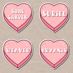 May include: Four pink heart-shaped stickers with white outlines. Each sticker has a different name written in white letters: Bone Carver, Suriel, Weaver, and Bryaxis.