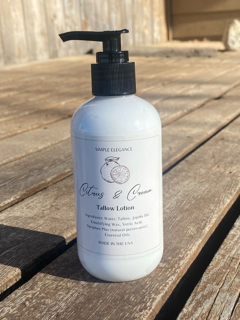 May include: White bottle of Citrus & Cream Tallow Lotion with a black pump top. The label has a citrus fruit illustration and the text "Simple Elegance".