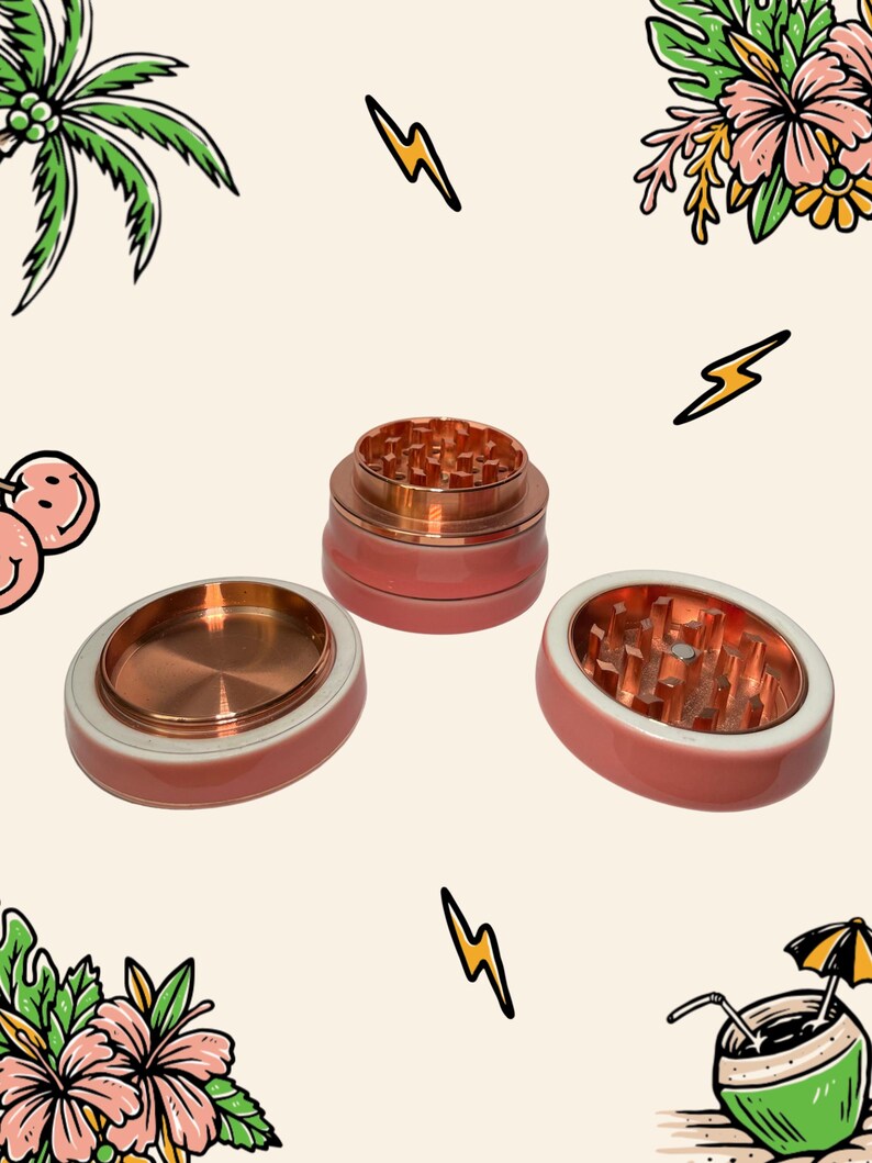 May include: A three-piece herb grinder with a metallic copper interior and a smooth, matte coral-pink exterior. The set includes a base, a middle section with sharp teeth, and a top lid, all featuring a consistent circular design and finish.