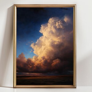 May include: A framed landscape painting depicts a dramatic sky filled with large, fluffy clouds. The clouds are illuminated with warm, golden light, contrasting with the deep blue and dark tones of the sky and the distant horizon.