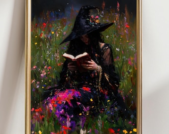 May include: A framed art print depicts a person in a black witch hat and dress, reading a red book in a colorful flower field. The artwork has a dark, romantic aesthetic with vibrant floral accents and a gold frame.