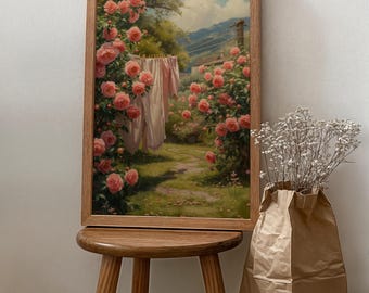 May include: A framed painting depicting a lush garden with pink roses in bloom. The garden path leads to a small house in the distance. White clothing hangs on a clothesline in the garden.