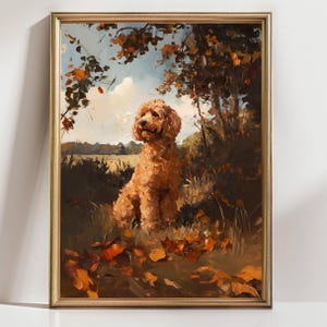 May include: A framed painting of a golden doodle dog sitting in a field. The dog is surrounded by autumn leaves and foliage. The artwork has a warm color palette with shades of brown, orange, and green, and is set against a backdrop of a blue sky.