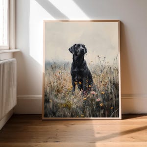 May include: A black Labrador Retriever dog sits in a field of wildflowers. The dog is looking up and has a soft, gentle expression. The background is a soft, blurred, watercolor-like painting of a field of wildflowers.