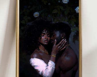May include: A framed art print featuring a tender embrace between a man and a woman. The artwork depicts the couple with dark skin, adorned with gold jewelry, set against a backdrop of dark foliage and white roses. The woman wears a white off-the-shoulder top.