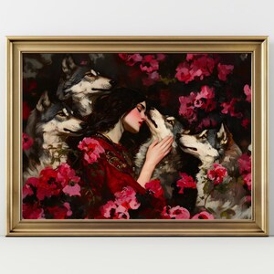 K&ouml;nnte beinhalten: Gerahmter Kunstdruck mit einer Frau in einem roten Kleid, umgeben von W&ouml;lfen und rosa Rosen. Die Frau ber&uuml;hrt sanft einen der W&ouml;lfe. Das Kunstwerk hat eine dunkle, romantische &Auml;sthetik.