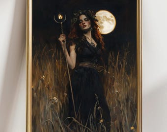May include: A framed print of a woman in a black dress holding a staff with a flame, standing in tall grass. A full moon is in the background. The artwork has a dark, mystical theme with a gold frame.