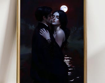 May include: A framed print of a romantic scene. A man in a black suit kisses a woman in a black dress. The background features a full moon and water, with a dark, moody color palette.