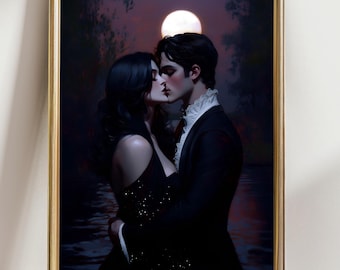 May include: A framed art print depicts a romantic scene of a couple kissing under a full moon. The man wears a black suit with a white ruffled collar, and the woman is in a black dress. The background features a dark, moody landscape.