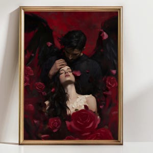 May include: A framed art print featuring a romantic scene with a man and woman surrounded by red roses. The man, with black wings, embraces the woman, who is wearing a white dress. The background is a deep red.