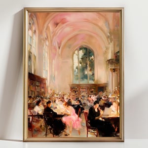 May include: A framed painting depicts a library interior with arched ceilings and large windows. People are seated at tables, reading or working. The color palette is soft, with warm tones of pink, beige, and brown. The artwork is in a gold frame.