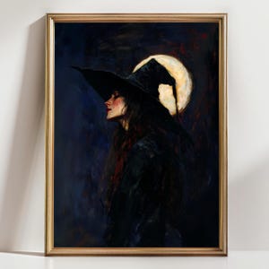 May include: A framed painting of a woman in profile, wearing a large black witch hat, with long dark hair. A full moon glows behind her. The artwork is in dark blues, blacks, and reds, with a gold frame. The painting evokes a gothic or fantasy theme.