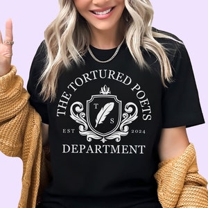 a woman wearing a t - shirt that says the featured dots department