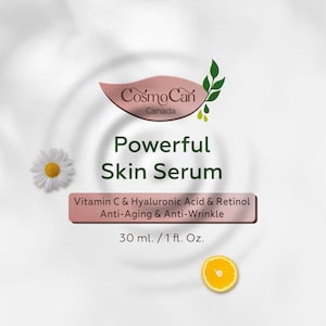 Pode incluir: Um r&oacute;tulo branco e rosa com o texto "CosmoCan Canada" e "Powerful Skin Serum" em um c&iacute;rculo branco com folhas verdes. O r&oacute;tulo tamb&eacute;m inclui o texto "Vitamin C & Hyaluronic Acid & Retinol Anti-Aging & Anti-Wrinkle 30 ml. / 1 fl. Oz."