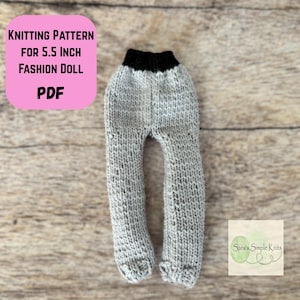 May include: Knitted doll pants in gray with a black waistband. The pants are designed for a 5.5-inch fashion doll. The image includes text that reads "Knitting Pattern for 5.5 inch Fashion Doll PDF".