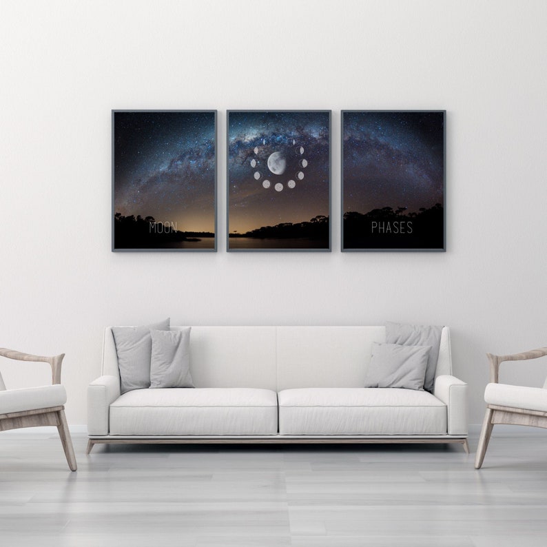May include: Three framed art prints depicting a night sky with the Milky Way and moon phases. The middle print shows the moon phases in a circular arrangement. The text "MOON" and "PHASES" are at the bottom of the left and right prints.