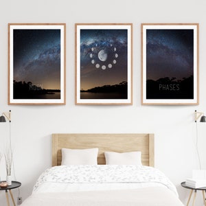 May include: Three framed art prints featuring night sky scenes. The left print has the word "MOON" at the bottom. The center print shows the phases of the moon. The right print has the word "PHASES" at the bottom. All prints have a wooden frame.