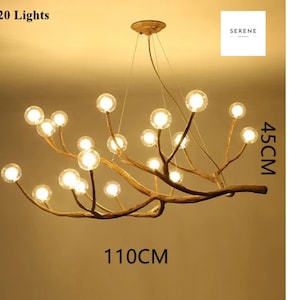 May include: A 20-light chandelier with a unique branch design. The chandelier is made of natural wood branches with clear glass globes. The chandelier measures 45 inches in height and 110 inches in width.