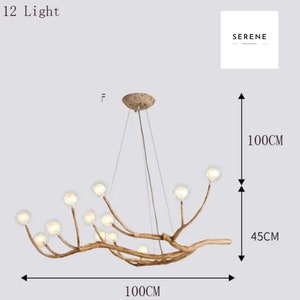 May include: A 12-light chandelier with a branch-like design and clear glass bulbs. The chandelier is 45 inches tall and 40 inches wide. The text "12 Light" and "SERENE" is visible in the image.