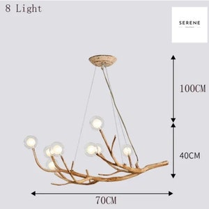 May include: An 8-light chandelier with a natural wood branch design and clear glass globes. The chandelier measures 70 inches wide, 40 inches high, and 100 inches tall.