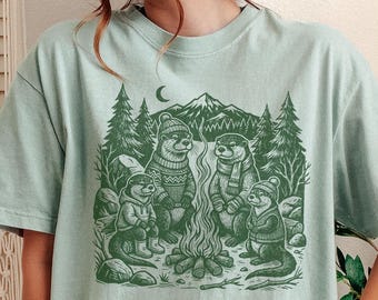 Otter Campfire T-Shirt – Cottagecore Winter Graphic Tee