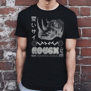 May include: Black t-shirt with a white graphic of a rhinoceros head, Japanese text, and the word "ROUGH" in a stylized font.