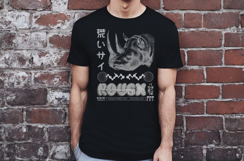 May include: Black t-shirt with a white graphic of a rhinoceros head, Japanese text, and the word "ROUGH" in a stylized font.
