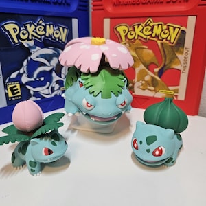 Bulbasaur, Ivysaur, Venusaur line figurines.