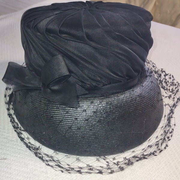 Vintage woman's hat with fancy veil and grosgrain ribbon band. Mfg Famous Barr. Ca. 1940s-50s.