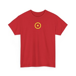 May include: Red t-shirt with a yellow circle and a yellow dot in the center. The shirt is made of a soft material and has short sleeves and a crew neck. The graphic is centered on the chest.
