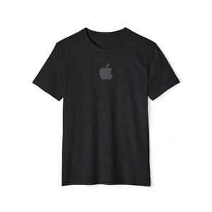 May include: Black crew neck t-shirt with a dark gray apple logo centered on the chest. The short-sleeved shirt is made of a soft material and is suitable for casual wear. The apple logo is a recognizable symbol.