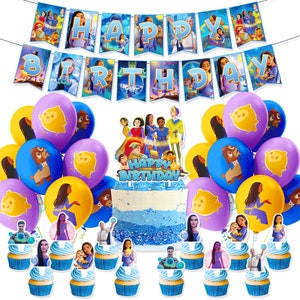 May include: A birthday cake with blue and white icing and a 'Happy Birthday' topper. The cake is surrounded by purple, blue and yellow balloons with cartoon characters on them. There are also cupcakes with cartoon characters on them.