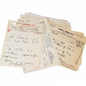 May include: A stack of vintage medical prescription forms with handwritten notes. The top form is from Hans J. Cohn, M.D. in Woodstock, NY. The form has a date of 11/2/1926 and a prescription for H.C.L. Dil 100, 1. Pepsin 7s 120.0, and Bing. tid. med.